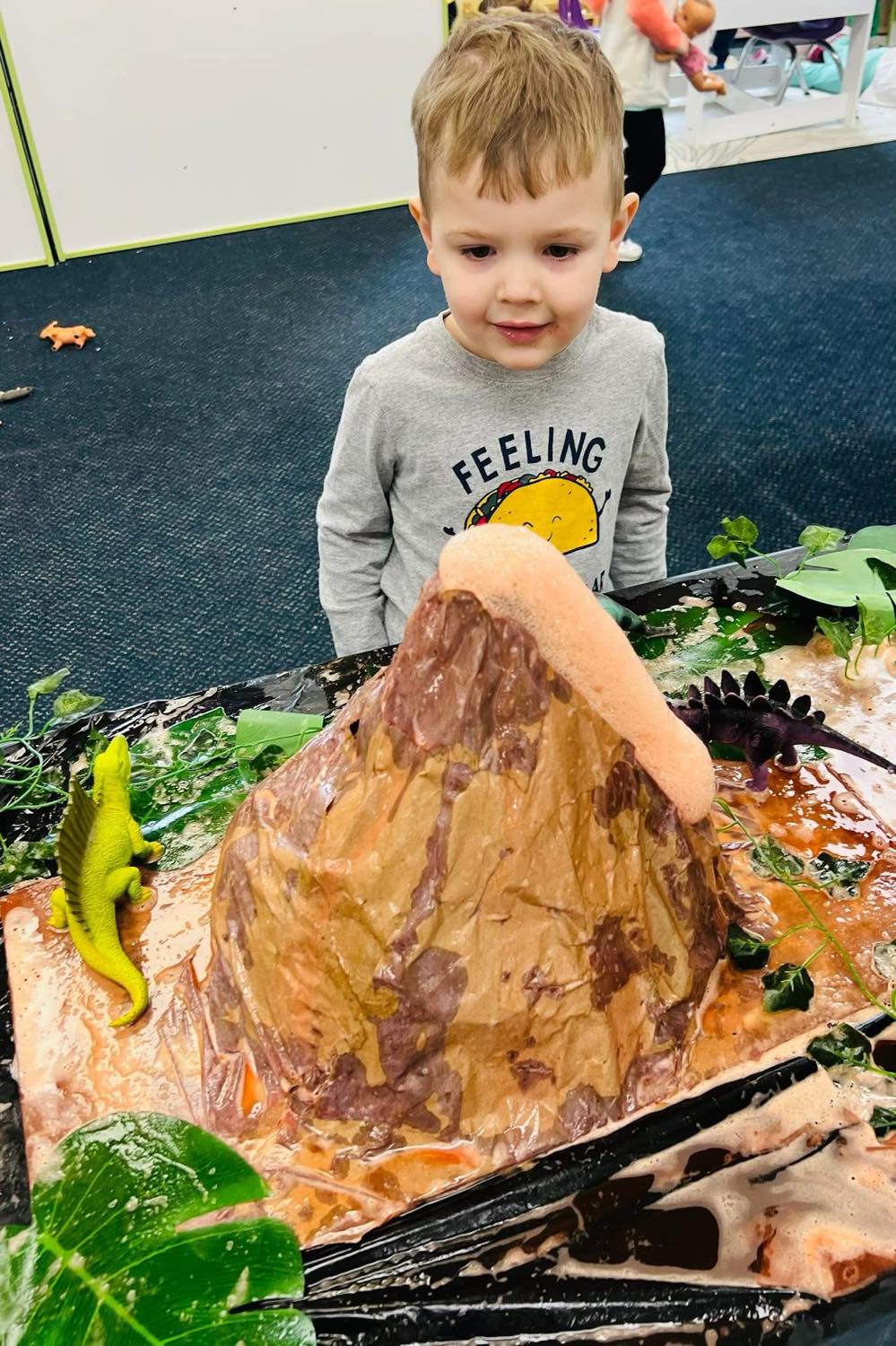 Child doing science experiment at Smart Beginnings Academy